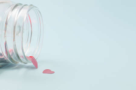Numerous red hearts with glass bottles with blue backgroundsの写真素材