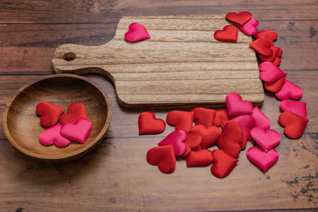 Wooden tableware and heart-shaped spongeの写真素材