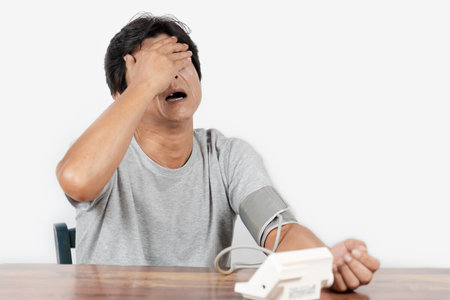 Middle-old man measuring blood pressureの写真素材