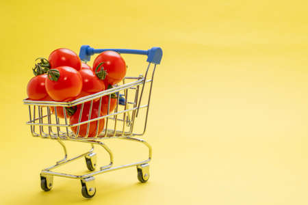 Cutting board with lots of petit tomatoesの写真素材