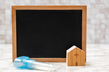 Blackboard and PCR test saliva containerの写真素材
