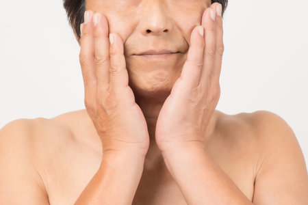 a middle-old man with a naked upper bodyの写真素材