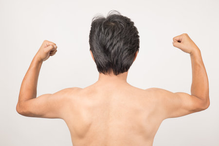 The back of a middle-old man with a naked upper body