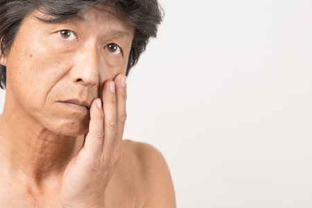Middle-old man with spots and wrinklesの写真素材