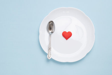 White dish and red heartの写真素材