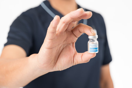 Image of the new corona vaccine in the hands of a doctorの写真素材