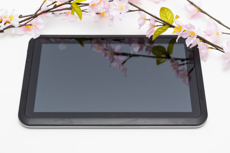 Cherry blossoms and tablet