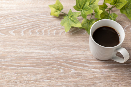Coffee and plants with wood grain backgroundの写真素材