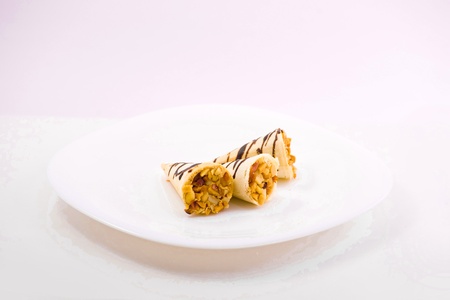 sweet cake on the plate isolated over white backgroudの写真素材