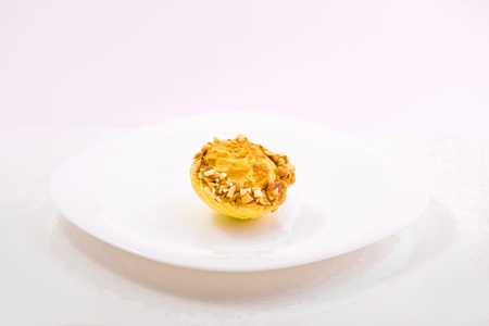 sweet cake on the plate isolated over white backgroudの写真素材