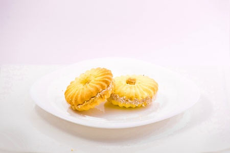sweet cake on the plate isolated over white backgroudの写真素材