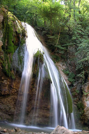 Big waterfall with a lot of green trees        の写真素材