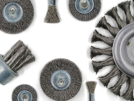 top view of metal brush for angle grinder and other brushes for metalworking isolated on white...
