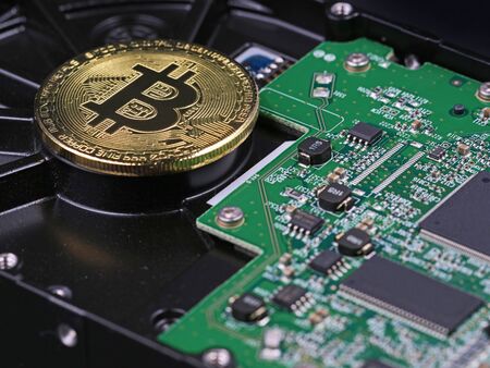 Bitcoin on hard drive, crypto currency digital money concept