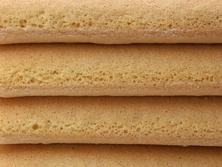 close up of stacked italian savoiardi cookie, biscuit background, texture of biscuitsの写真素材