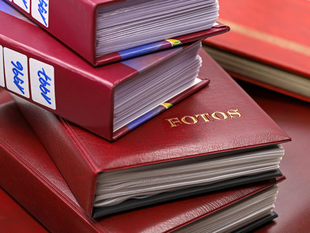 Stack of old photo albums with the word Fotos printed in Germanの写真素材
