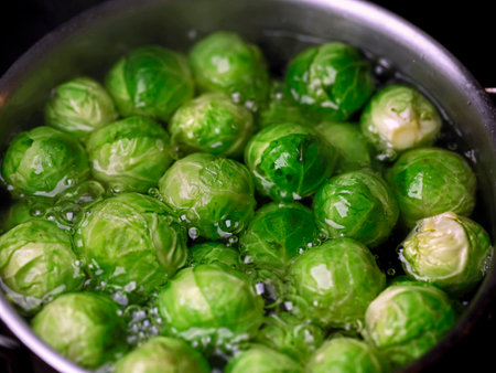 Close up of Brussels sprouts in boiling water potの写真素材