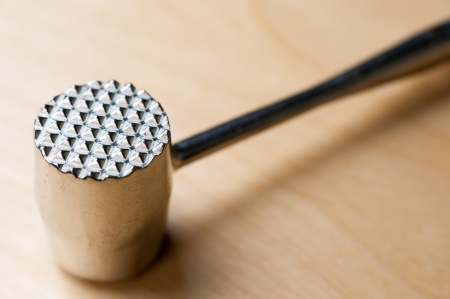 Meat Hammer on Wooden Tableの写真素材