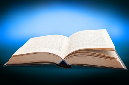 Book opened on Turquoise Backgroundの写真素材