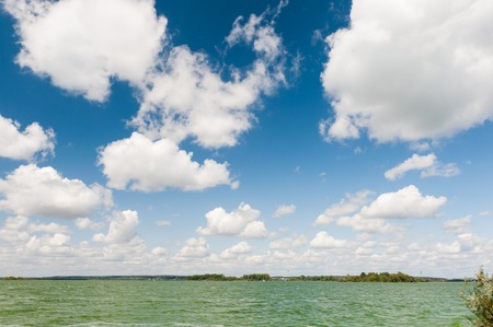 Lake under  blue sky with clouds の写真素材
