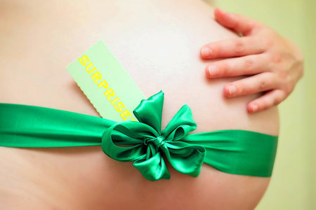 Pregnant woman with a surpriseの写真素材