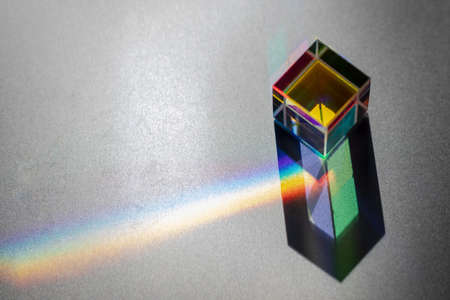 Colored square crystal with a rainbow on a substrate in close-upの写真素材
