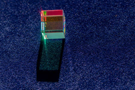 Colored square crystal with a rainbow on a substrate in close-upの写真素材