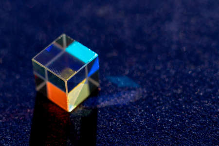 Colored square crystal with a rainbow on a substrate in close-upの写真素材