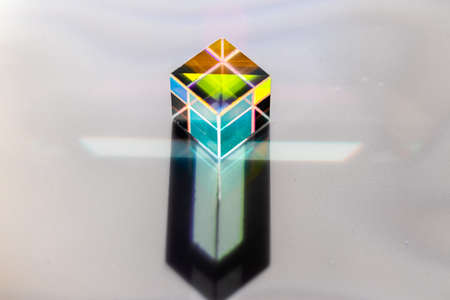 Colored square crystal with a rainbow on a substrate in close-upの写真素材