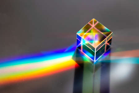 Colored square crystal with a rainbow on a substrate in close-upの写真素材