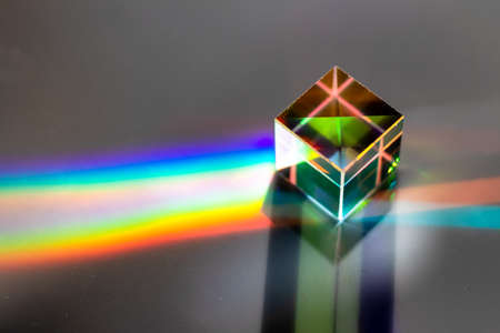 Colored square crystal with a rainbow on a substrate in close-upの写真素材