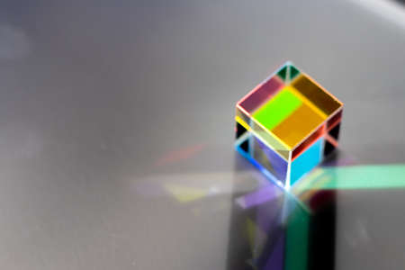 Colored square crystal with a rainbow on a substrate in close-upの写真素材