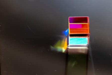 Colored square crystal with a rainbow on a substrate in close-upの写真素材