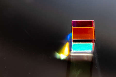 Colored square crystal with a rainbow on a substrate in close-upの写真素材