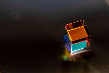Colored square crystal with a rainbow on a substrate in close-upの写真素材
