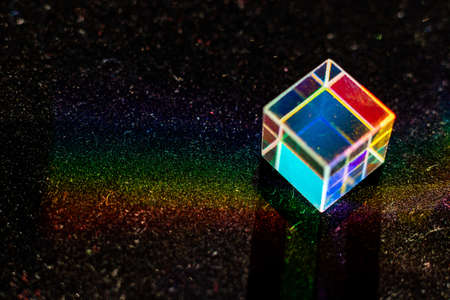 Colored square crystal with a rainbow on a substrate in close-upの写真素材