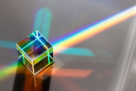 Colored square crystal with a rainbow on a substrate in close-upの写真素材