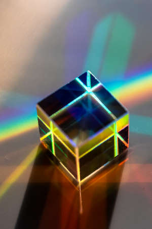 Colored square crystal with a rainbow on a substrate in close-upの写真素材