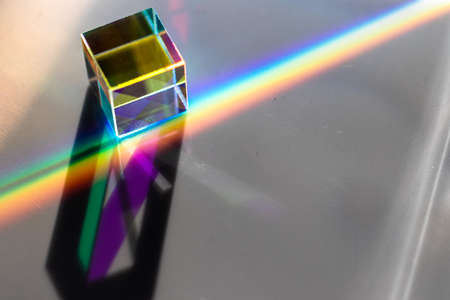 Colored square crystal with a rainbow on a substrate in close-upの写真素材