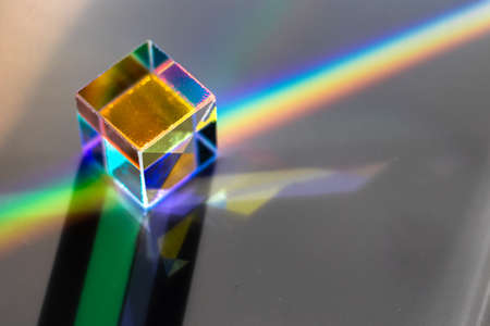 Colored square crystal with a rainbow on a substrate in close-upの写真素材