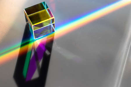 Colored square crystal with a rainbow on a substrate in close-upの写真素材