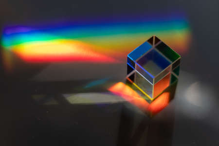 Colored square crystal with a rainbow on a substrate in close-upの写真素材