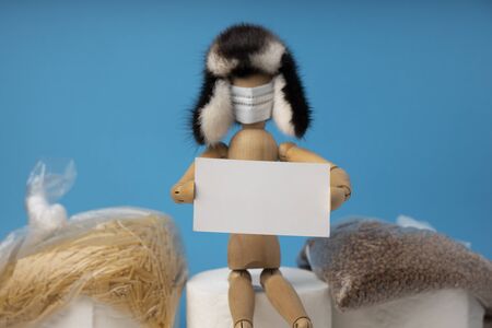 A man sits on the toilet paper rolls.の写真素材