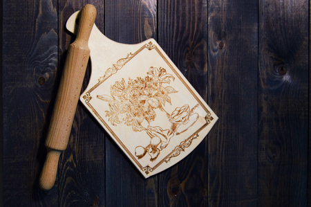 Plunger and finishing board on wooden backgroundの写真素材