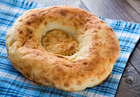 Delicious bread on tablecloth