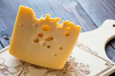 cheese on a cutting boardの写真素材