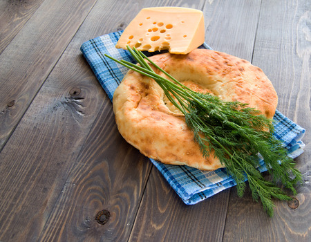 Delicious bread, cheese and dill on tableclothの写真素材