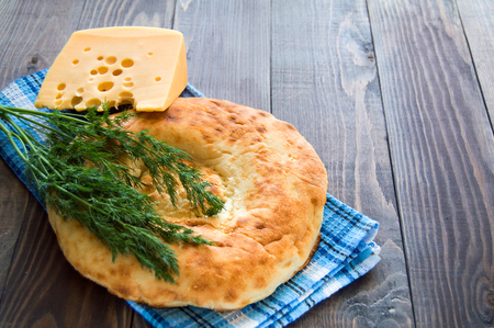 CHEESE BREAD AND UKROP ON THE TABLEの写真素材