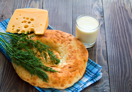 Delicious breakfast bread, cheese and dill on tableclothの写真素材