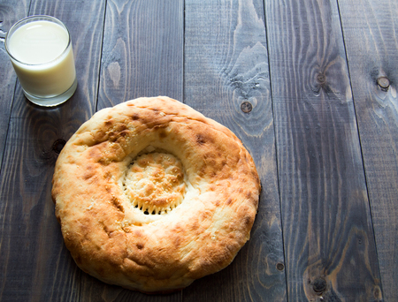 Bread and milk on wooden tableの写真素材